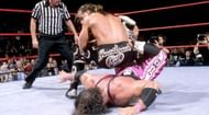 HBK locking in the Sharpshooter on Bret Hart